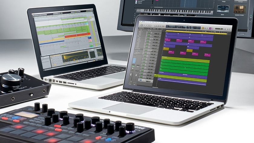 Two laptops for music production with an audio interface and MIDI controller