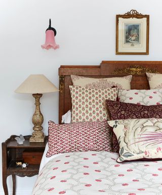 Wooden bed frame, red cushion