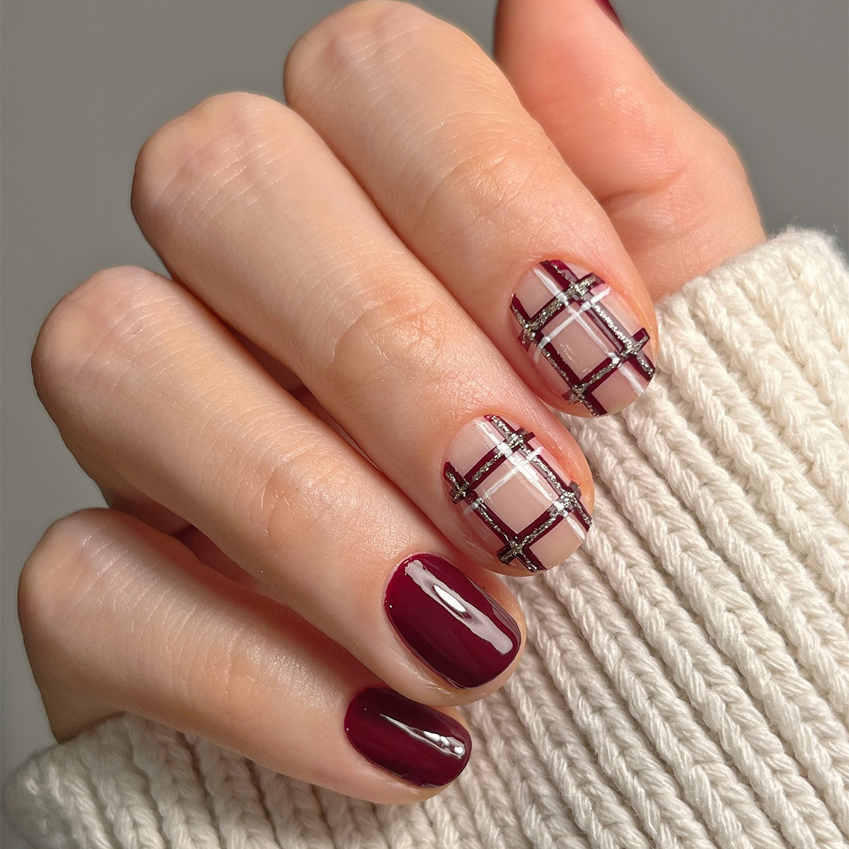 A burgundy, plaid manicure by Ana (Pink Oblivion)