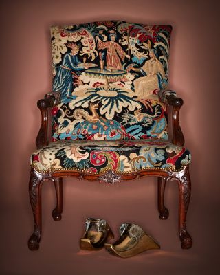 Rockefeller collection A George II mahogany library armchair and a pair of 19th century Dutch brass shoe-form wall brackets