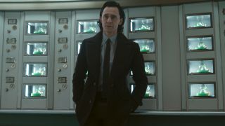 Tom Hiddleston standing in the TVA automat, looking rather upset, in Loki Season 2.