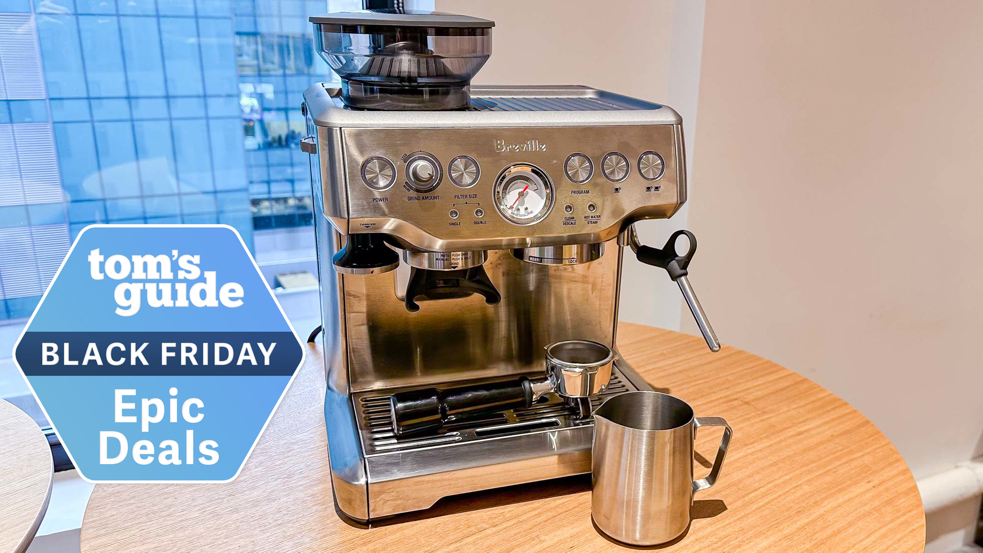 A Breville Barista Express espresso machine on a table with a Tom&#039;s Guide Black Friday deals badge