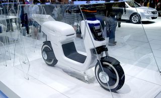 White Volkswagen E Scooter Side view