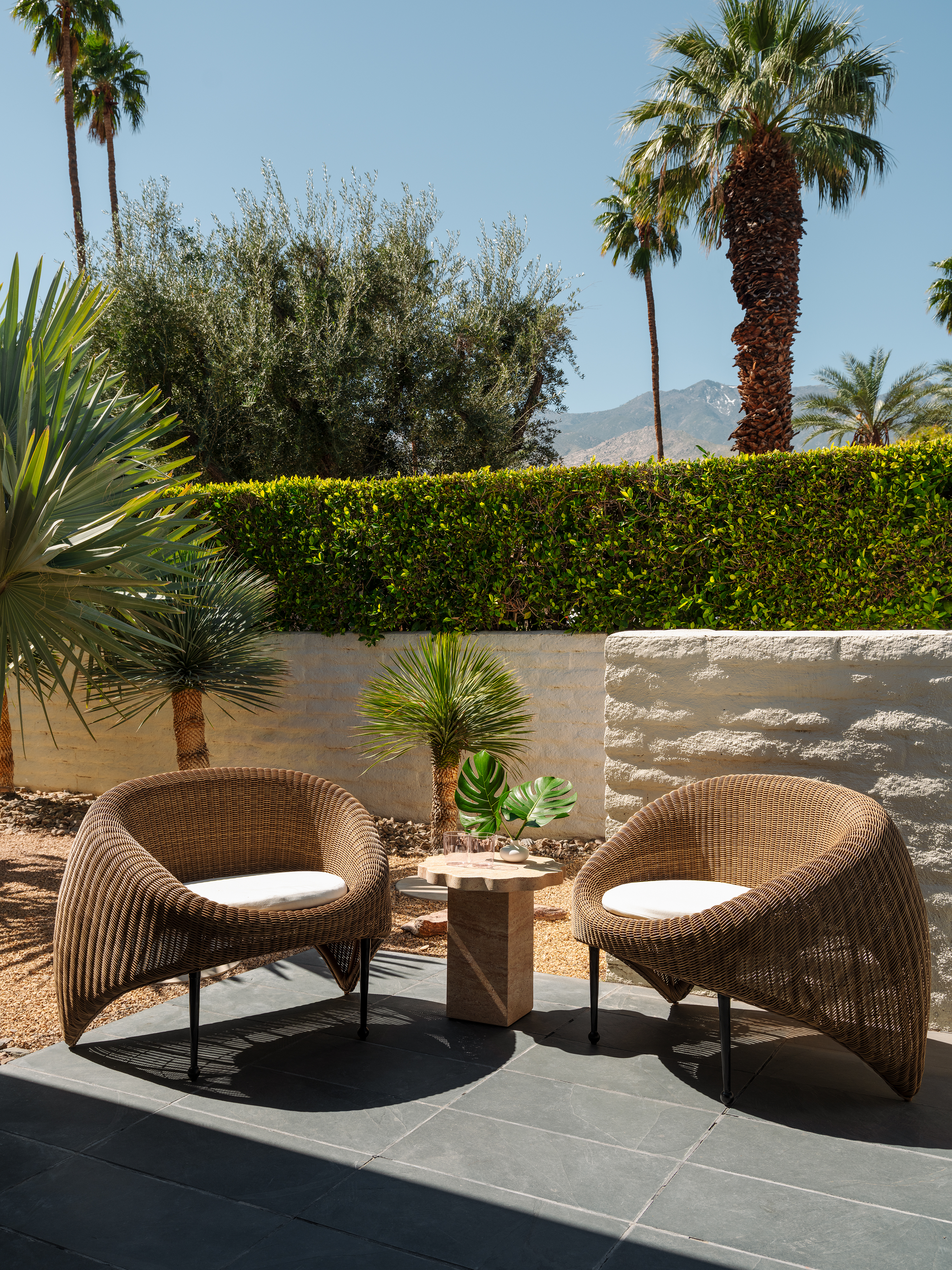Outdoor patio area with rattan seating