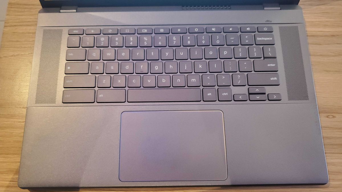 Chromebook Plus laptop on wooden table