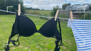 A bra hanging on the clothing line - the final step of how to wash bras by hand