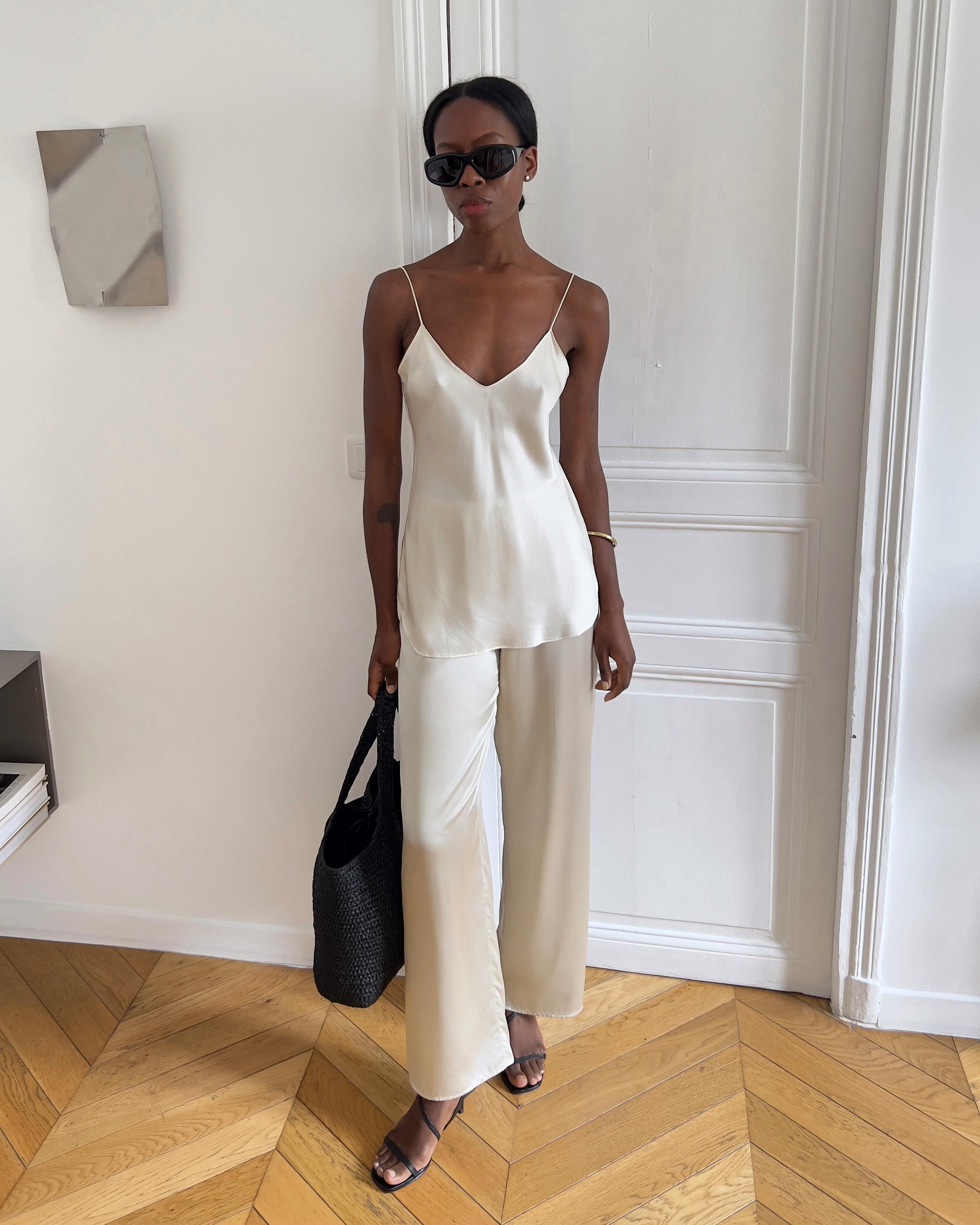 @sylviemus_ wearing a satin set.