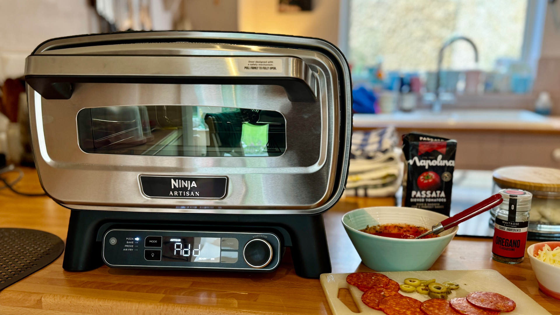 Ninja Artisan Electric Pizza Oven &amp; Air Fryer in kitchen