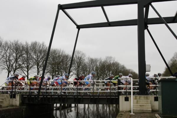 The peloton crosses one of the many bridges along the route.