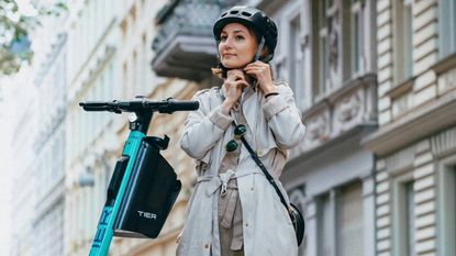 This new electric scooter comes with an integrated folding helmet!