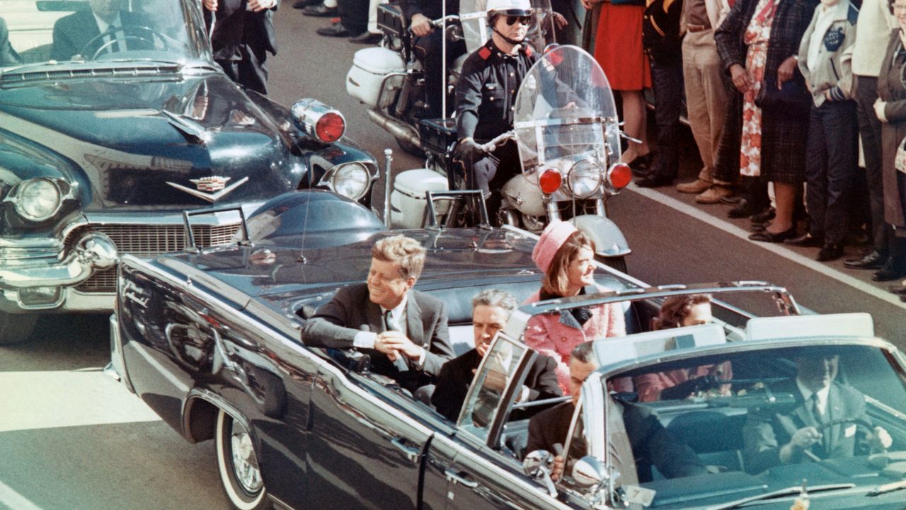 John F. Kennedy alongside his wife Jacqueline moments before he was shot