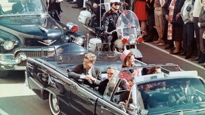 John F. Kennedy alongside his wife Jacqueline moments before he was shot