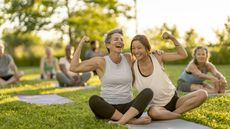 Women smiling doing an outdoor exercise class