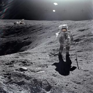 Astronaut John W. Young, the commander of Apollo 16, captured this image of Charles Duke collecting lunar samples near Plum Crater.