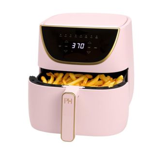 A pink Paris Hilton air fryer with a black LED display and a pink basket with chips inside of it