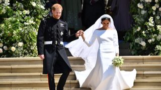 Britain's Prince Harry, Duke of Sussex and his wife Meghan, Duchess of Sussex emerge from the West Door of St George's Chapel, Windsor Castle, in Windsor, after their wedding ceremony.