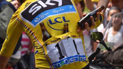 Yellow jersey rider with beer bottles in his jersey pocket at the Tour de France