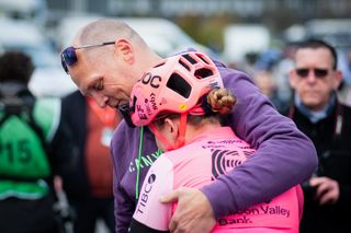 Zoe and Magnus Bäckstedt embracing at the finish of Paris-Roubaix 2023