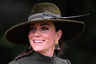 Kate's earrings appear to include black gemstones