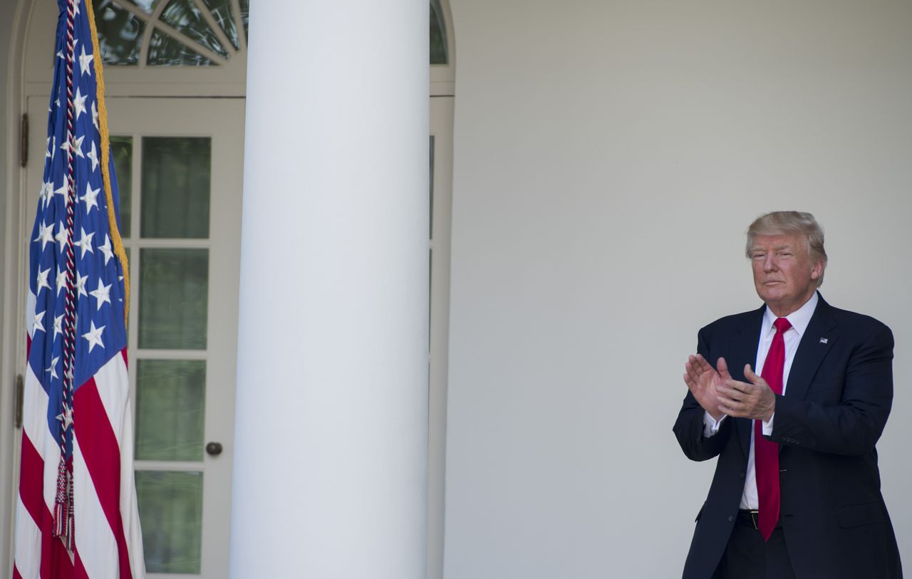 President Trump applauds outside the White House