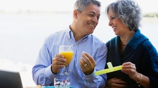 man and woman laughing together over breakfast
