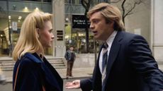 A still from biopic "The Apprentice", with actress Maria Bakalova playing Ivana Trump on the left and actor Sebastian Stan playing Donald Trump on the right, standing on a New York street