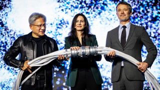 King Frederik X of Denmark (R), CEO and founder of Nvidia Jensen Huang (L), and CEO of the Danish Centre for AI Innovation A/S, Nadia Carlsten (C), symbolically switch on the new AI supercomputer named Gefion at the Vilhelm Lauritzen Terminal in Kastrup, Denmark, on October 23, 2024. 