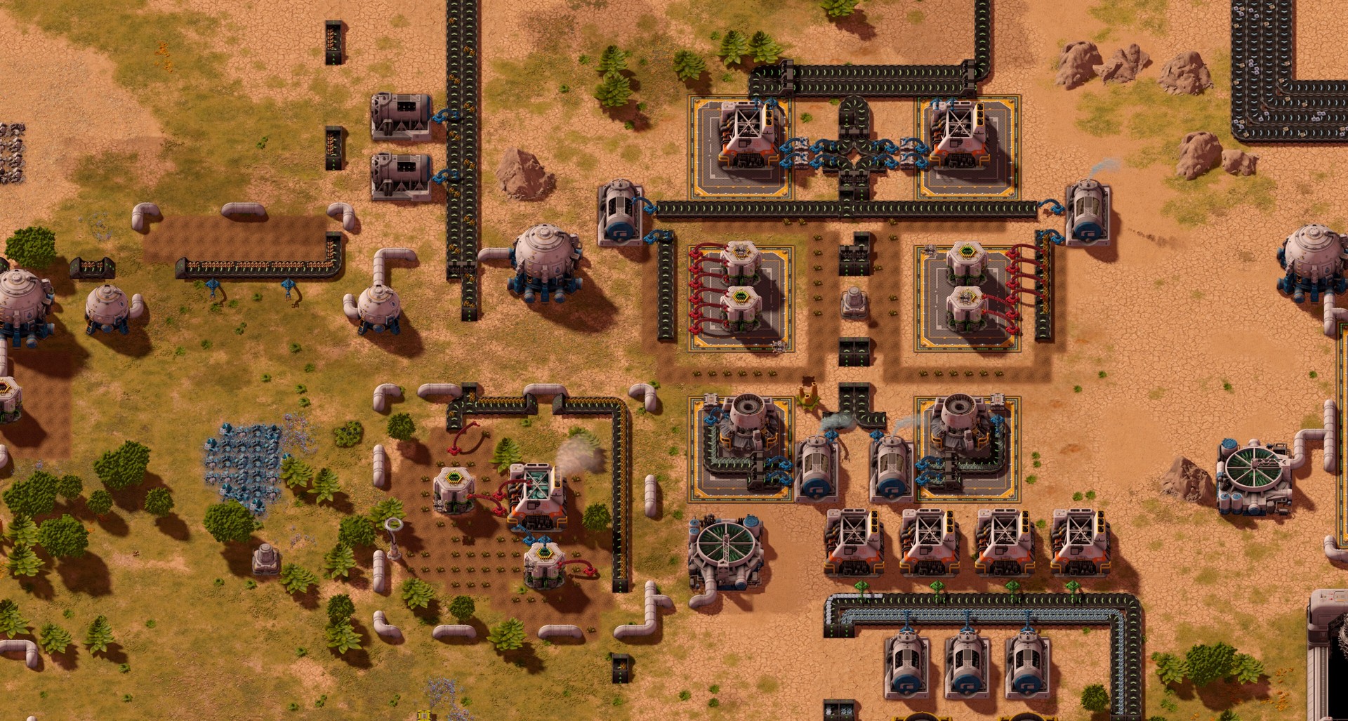 A zoomed-out view of a detailed, complex factory on an alien planet in Substructure