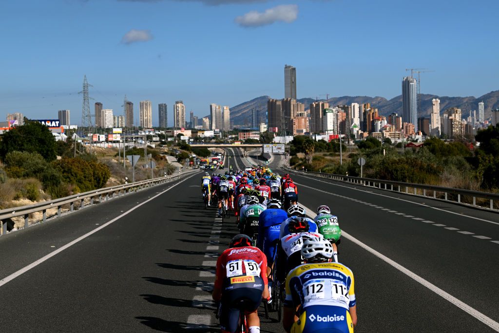 ALTEA SPAIN FEBRUARY 01 A general view of the peloton passing through a Benidorm city landscape during the 74th Volta a la Comunitat Valenciana 2023 Stage 1 a 1894km stage from Orihuela to Altea VCV2023 VoltaValenciana on February 01 2023 in Altea Spain Photo by Dario BelingheriGetty Images