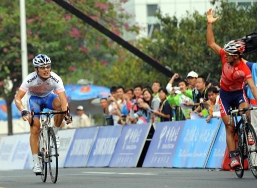 Kam Po Wong (Hong Kong), right, protested the actions of Korea's Park Sung-baek in the sprint for gold resulting in the relegation of the Korean to 19th and the gold medal for Wong.