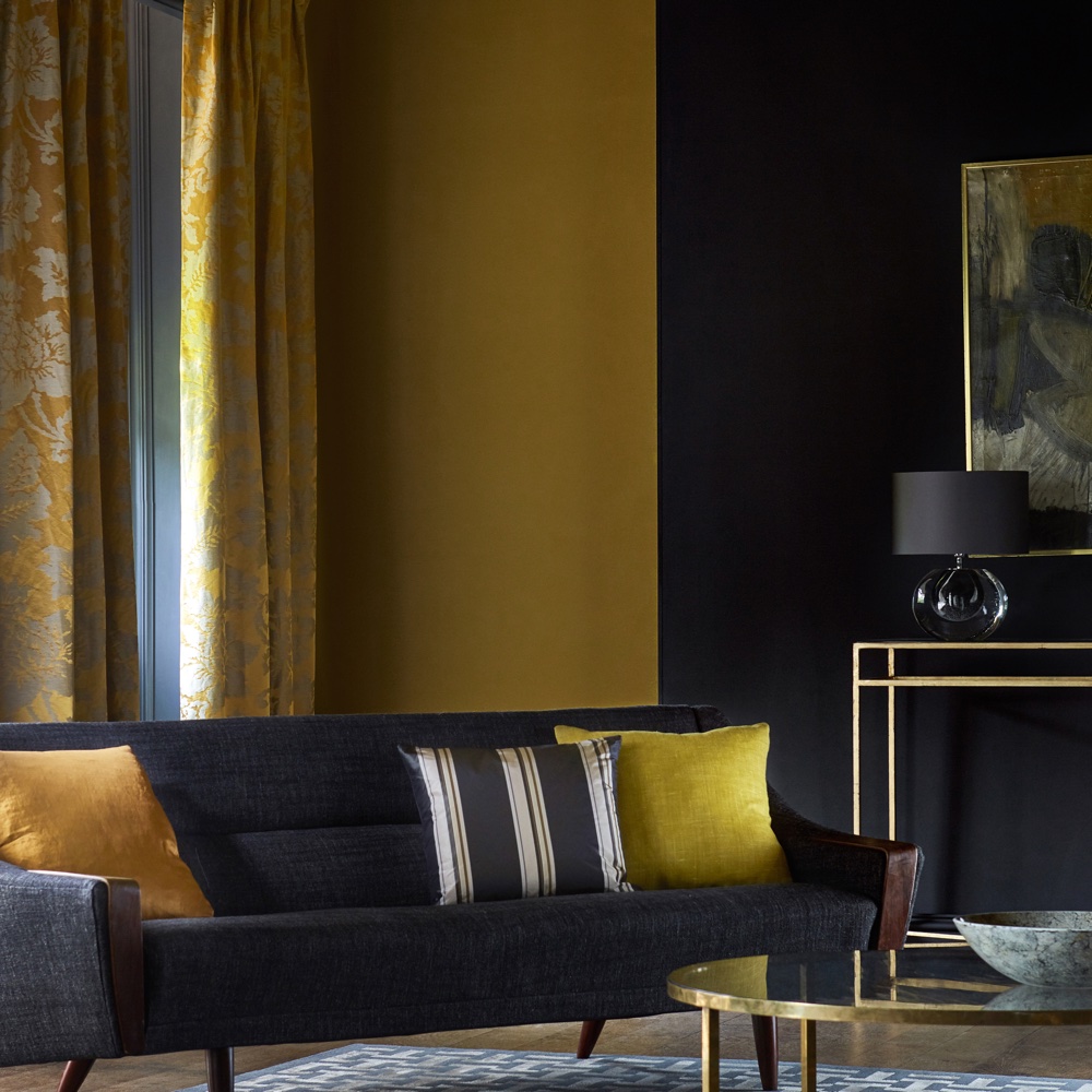 living area with blue and yellow and blue sofa