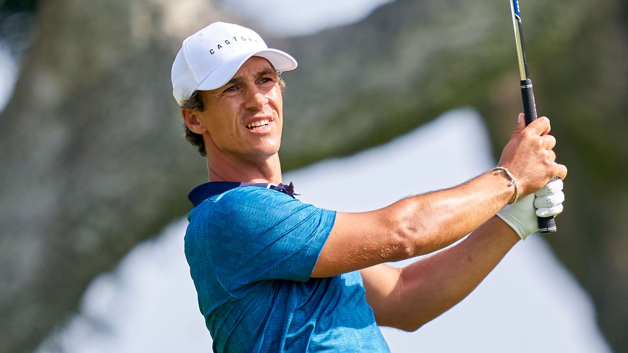 Thorbjorn Olesen holds his finish after hitting an iron shot