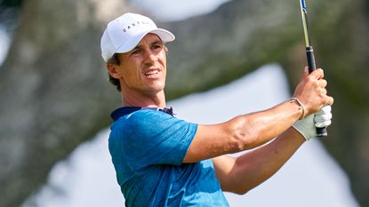 Thorbjorn Olesen holds his finish after hitting an iron shot