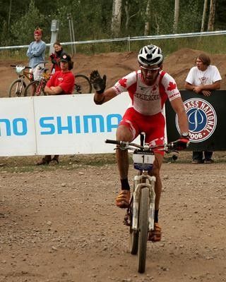 Geoff Kabush (Team Maxxis) crosses the line in third