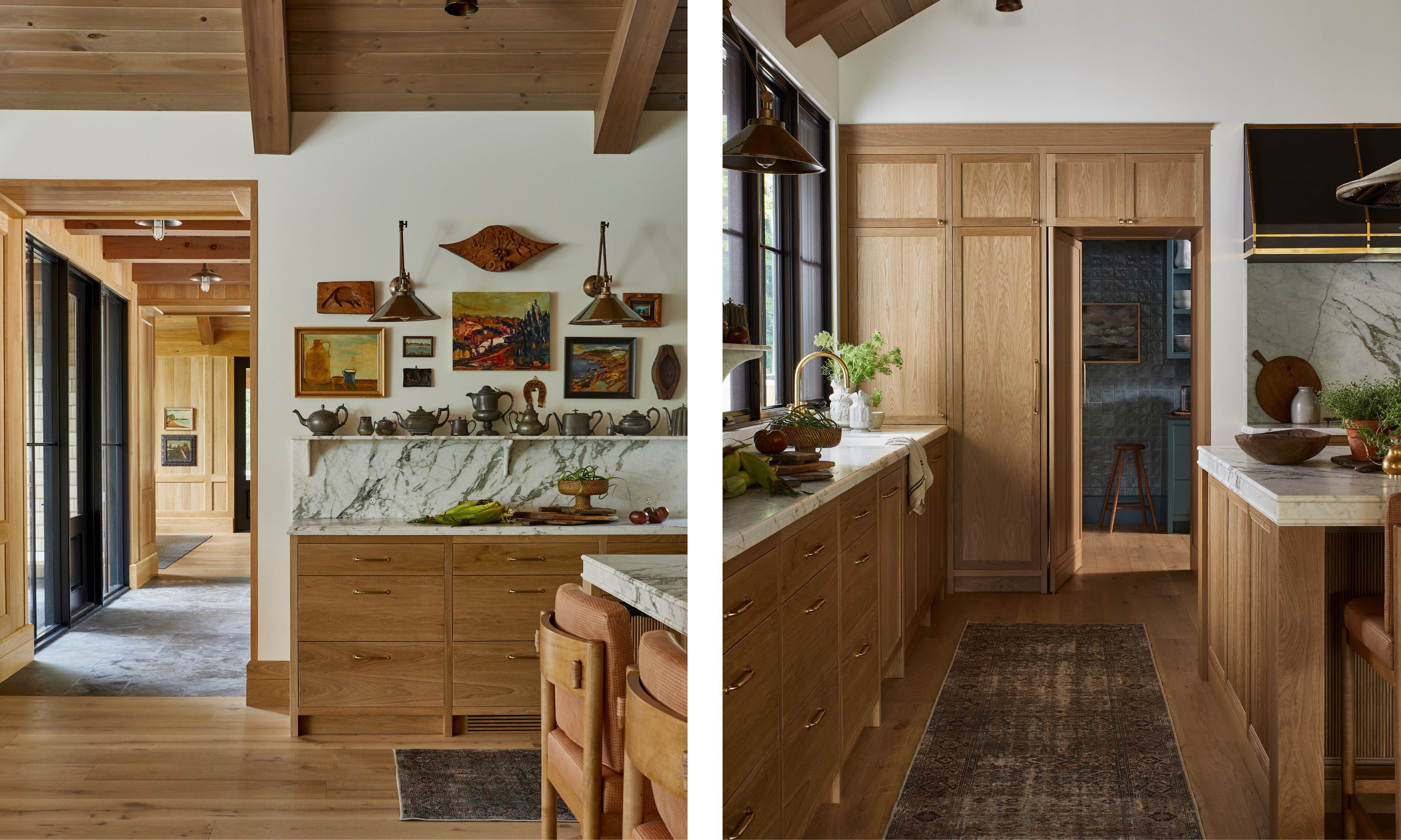 A kitchen featuring light oak cabinetry, marble countertops, and vintage-style brass hardware with a view into a walk-in pantry.