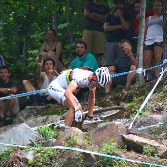 World champion Nino Schurter goes down in a rock garden