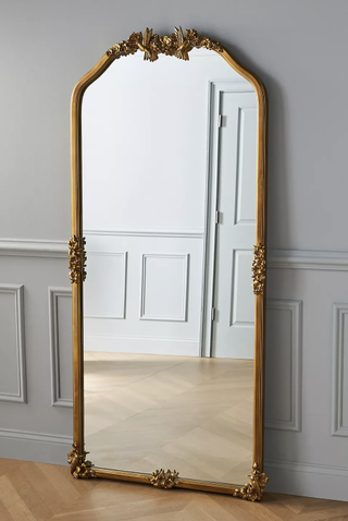 Ornate gold brass floor mirror from Anthropologie.