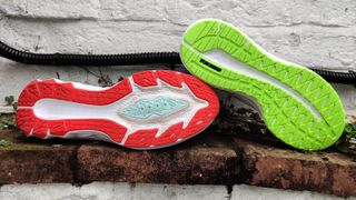 a view of the ASICS Novablast 2 and Puma Magnify Nitro running shoes' sole