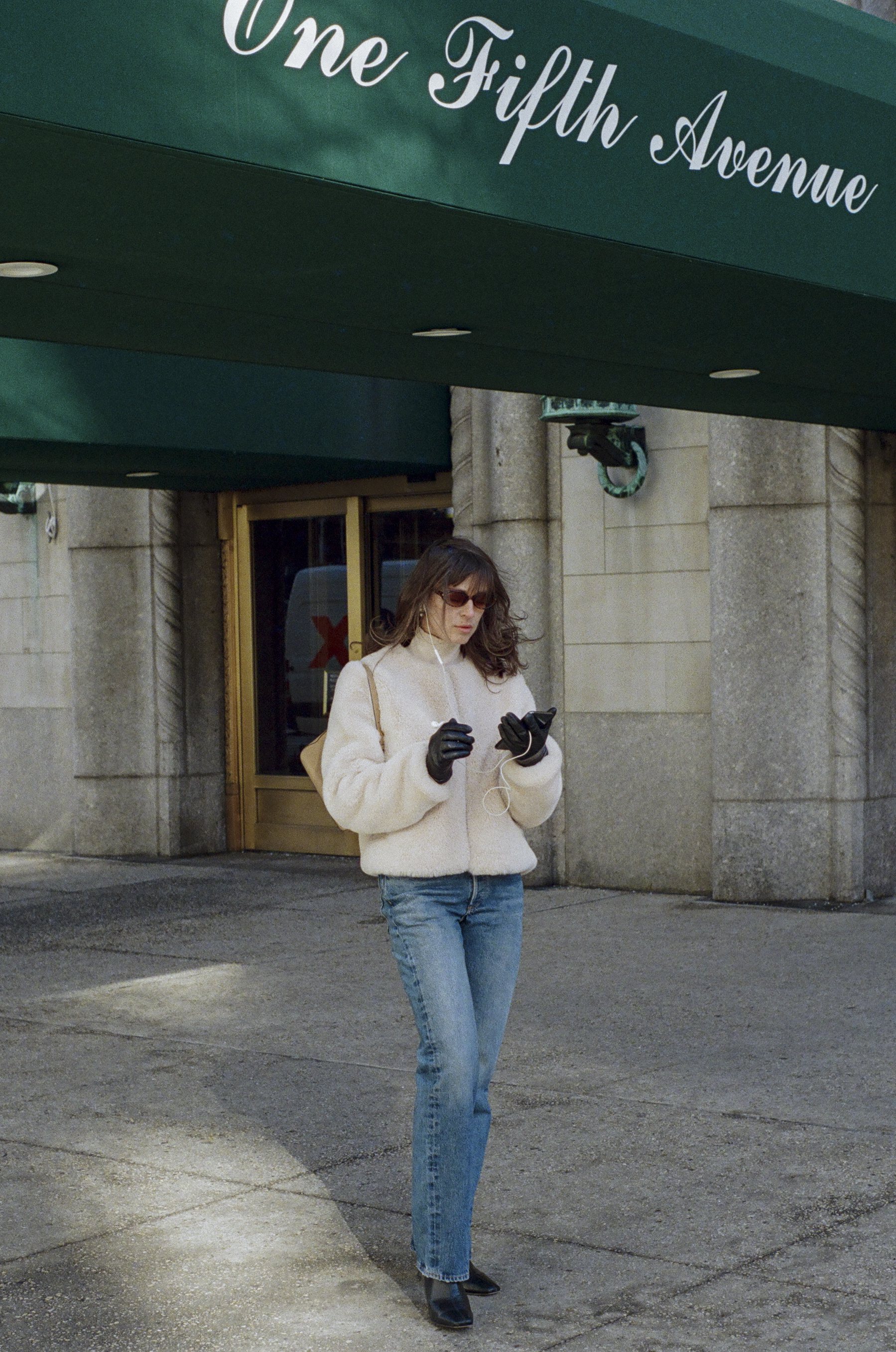 Kathryn Zahorak wearing fur jacket, jeans, boots
