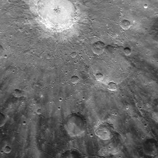 Bright rays, consisting of impact ejecta and secondary craters, radiate from Mercury's Debussy crater, located at the top. The image, acquired by NASA's Messenger spacecraft on March 29, 2011, shows a small portion of Debussy's large system of rays in greater detail than ever before.