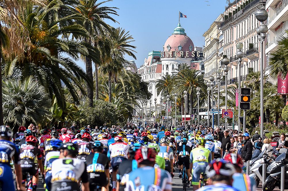 Riders approach the Hotel Negresco during stage 6 at Paris-Nice.