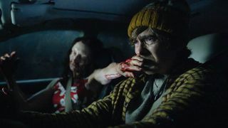 A zombie covering a van driver's mouth in Sony's 2026 Resident Evil movie