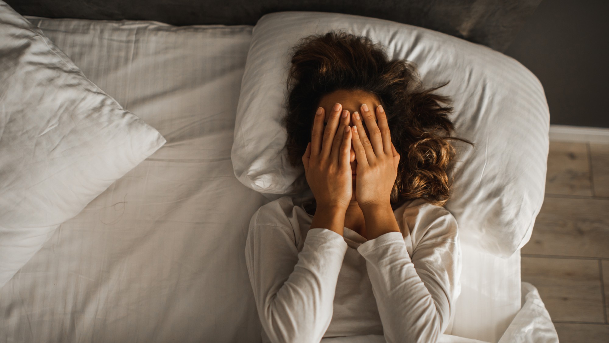 A stock photo of a woman who is unable to sleep.