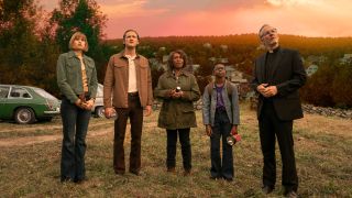 From left to right: Makenzie Leigh, Lewis Pullman, Alfre Woodard, Jordan Preston Carter and John Benjamin looking up with a sunset behind them in Salem's Lot.