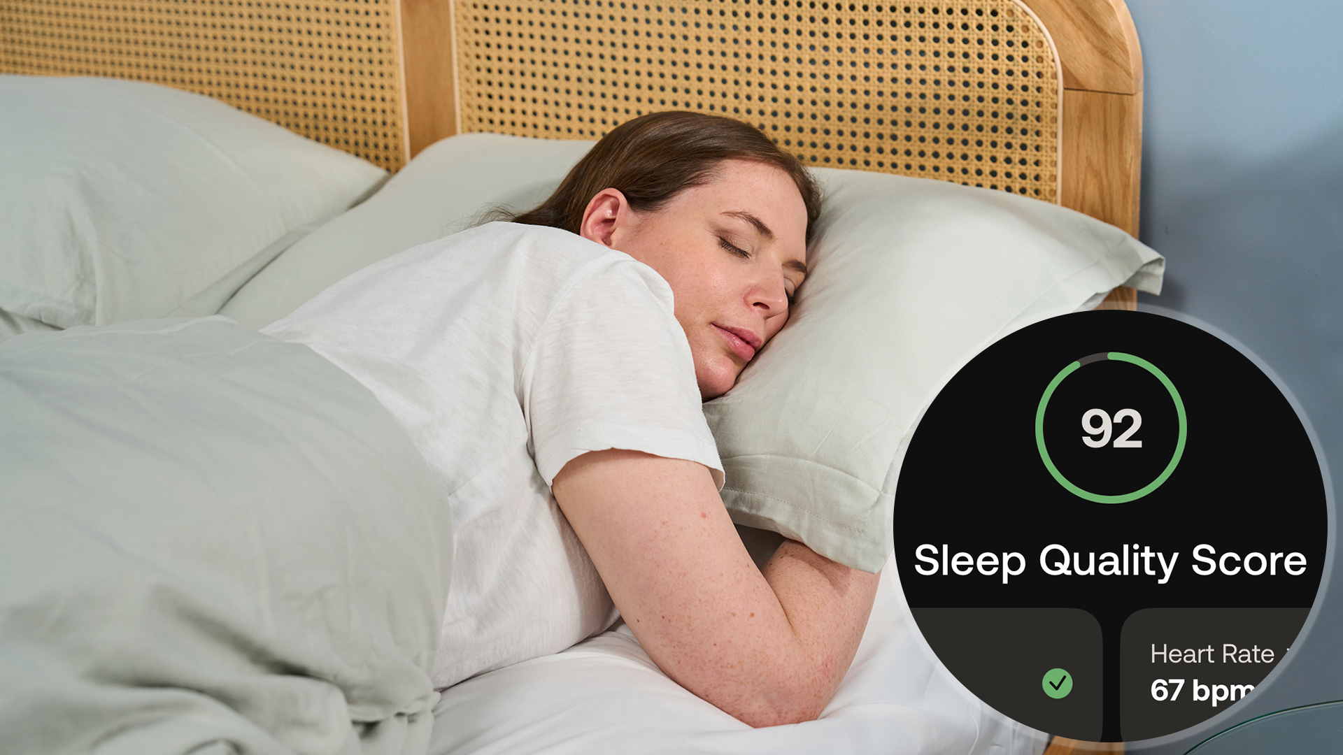 A woman lies asleep in bed looking comfy, in the bottom right corner is a screenshot of a 92 sleep score from the Withings Health Sleep App