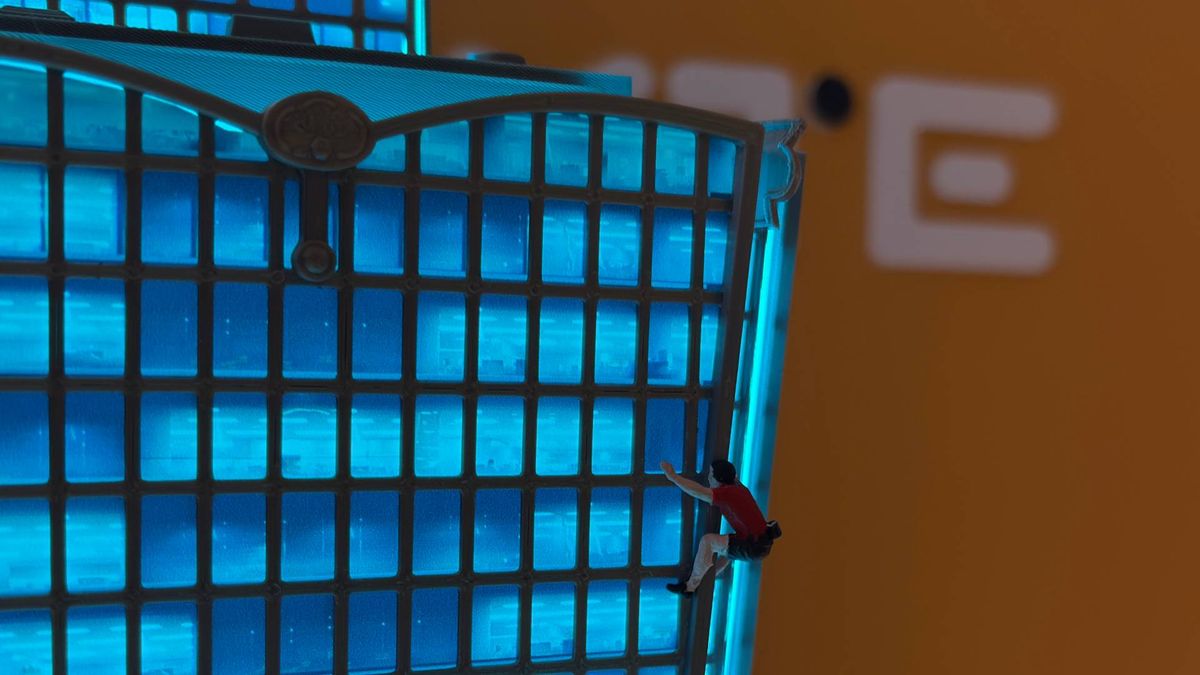 A tiny 3D printed Alex Honnold free solos up the side of a much bigger 3D printed recreation of the Taipei 101 building.