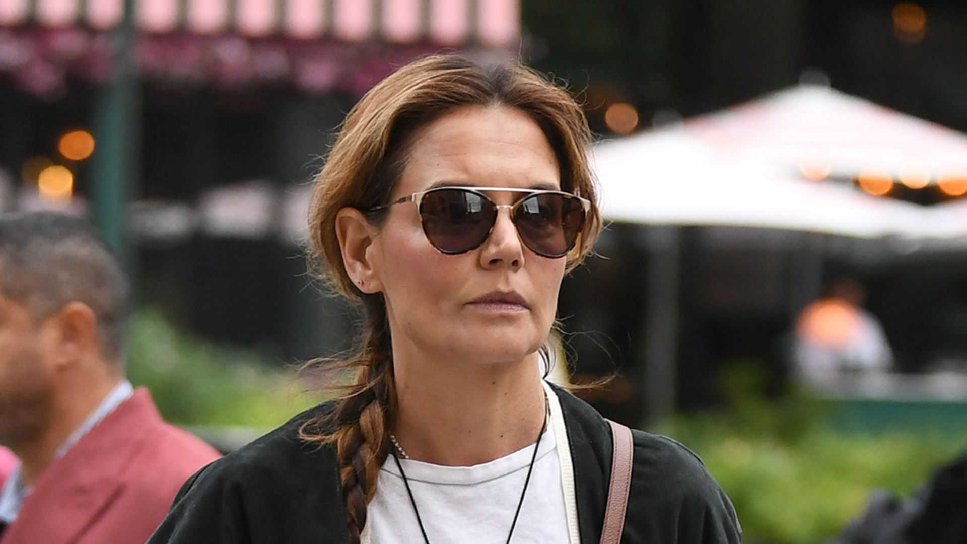 Katie Holmes spotted with her hair in a long braid and wearing a DeMellier bag on October 29, 2025 in New York City