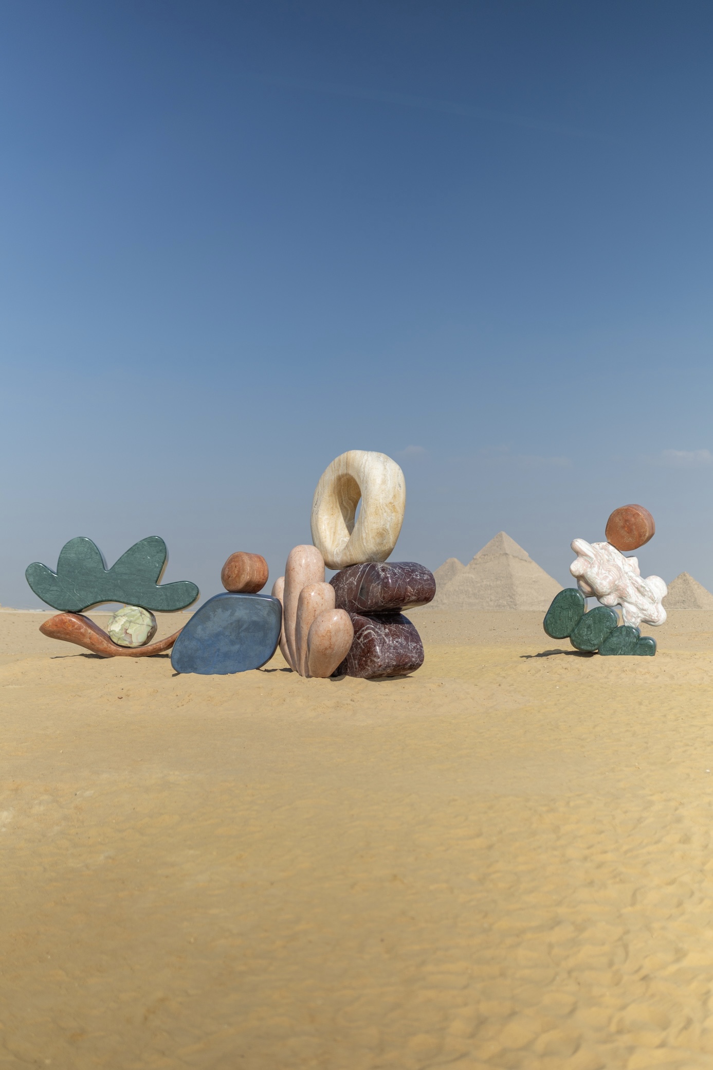 Giza Pyramids with colourful marble installation by Studio Proba