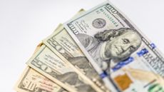 Cash fanned out on a table.