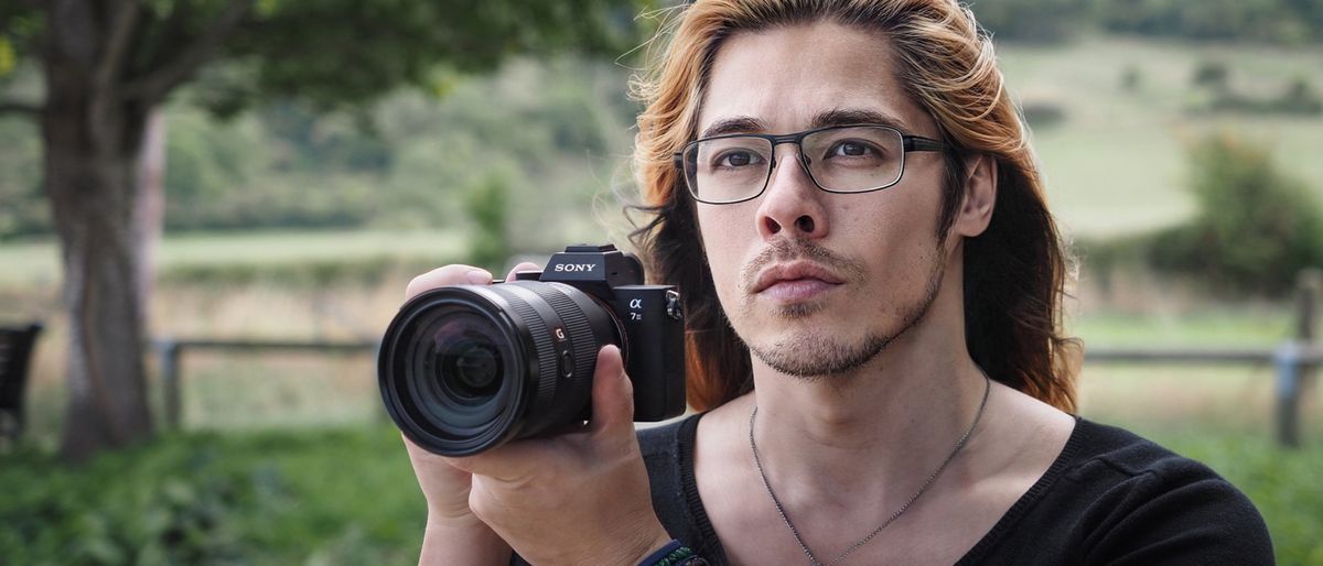 Reviewer holding Sony A7 III